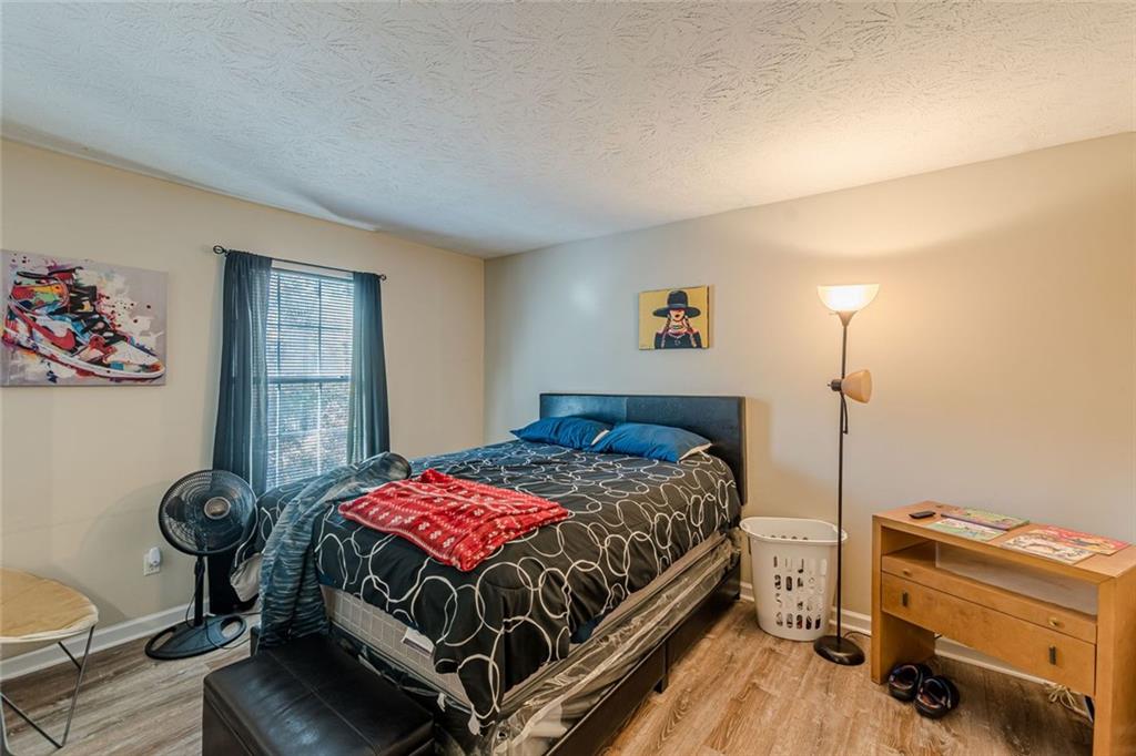 3477 Kingswood Trail Decatur, GA 30034 - Photo 8 of 44 a bedroom with a bed and a dresser in it