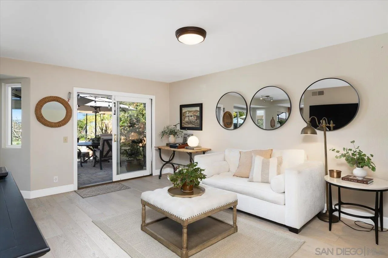 3746 Kelton Drive Oceanside, CA 92056 - Photo 12 of 49 a living room with furniture a rug and white walls