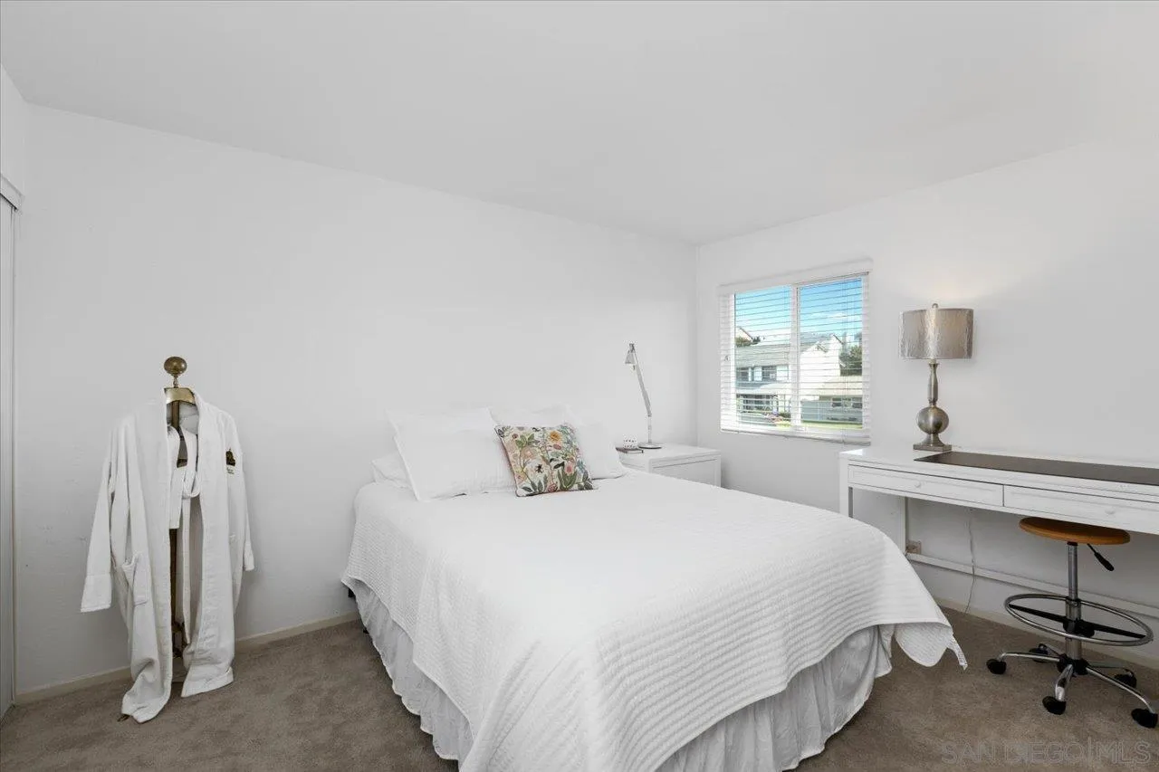 3746 Kelton Drive Oceanside, CA 92056 - Photo 25 of 49 a bedroom with a bed and a table in it