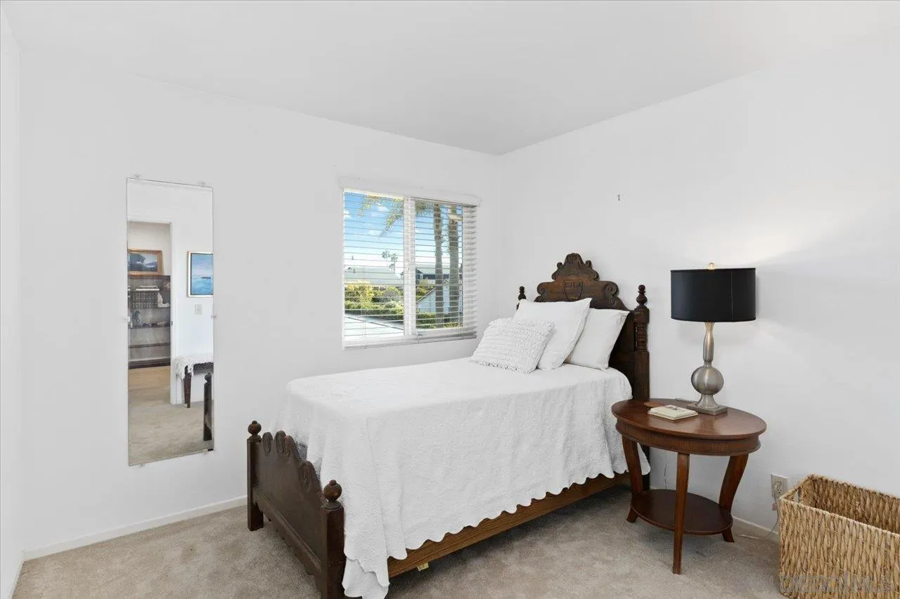 3746 Kelton Drive Oceanside, CA 92056 - Photo 26 of 49 a bedroom with a bed and a night stand