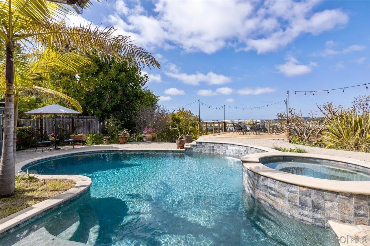 3746 Kelton Drive Oceanside, CA 92056 - Photo 29 of 49 a view of swimming pool with lawn chairs and plants