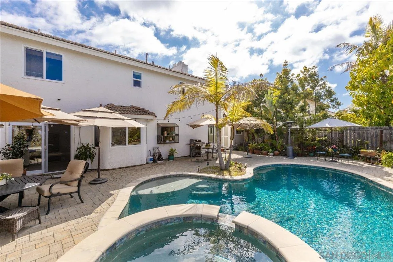 3746 Kelton Drive Oceanside, CA 92056 - Photo 30 of 49 a front view of a house with swimming pool and sitting area