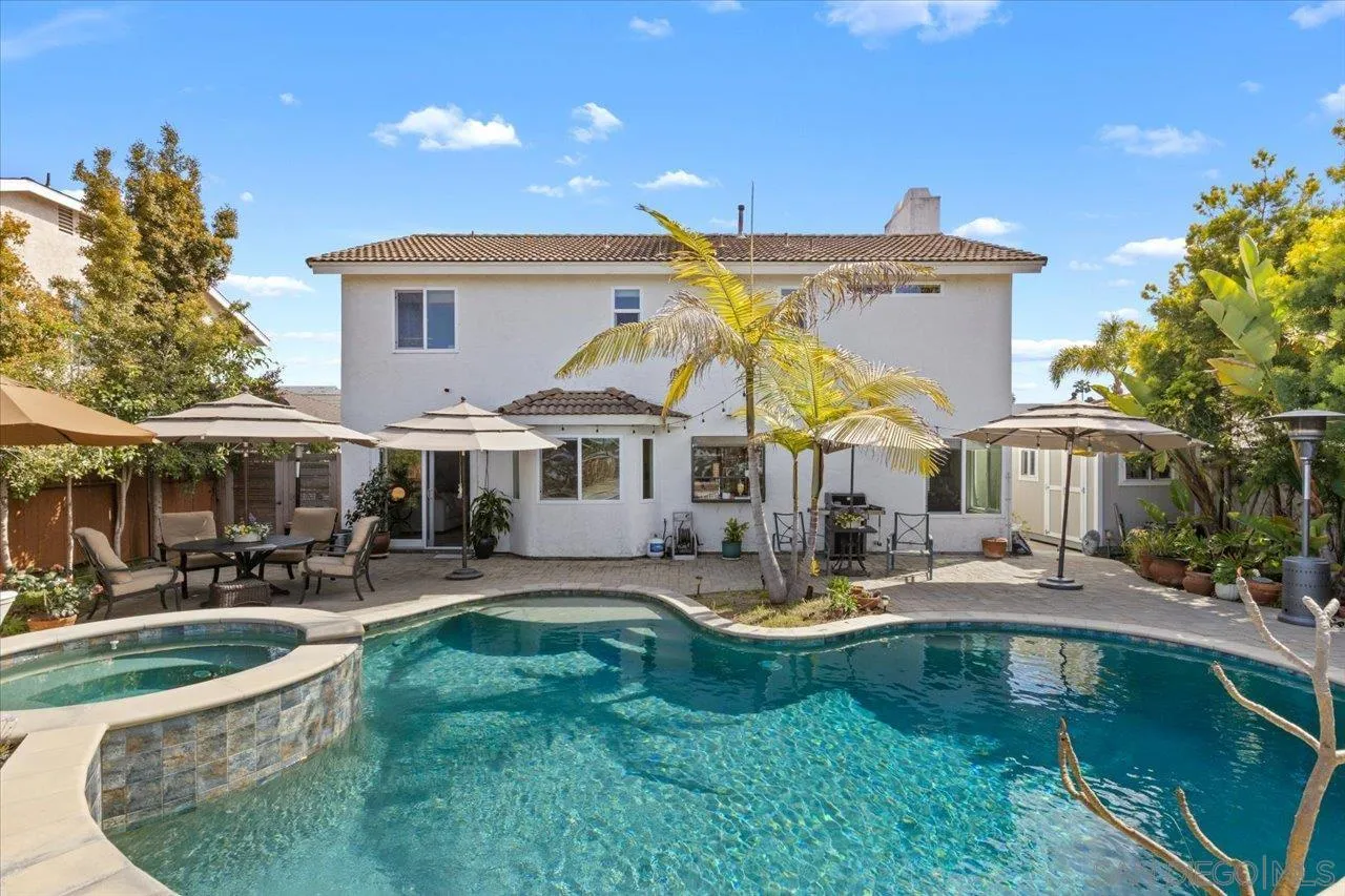 3746 Kelton Drive Oceanside, CA 92056 - Photo 34 of 49 a front view of a house with garden and sitting area