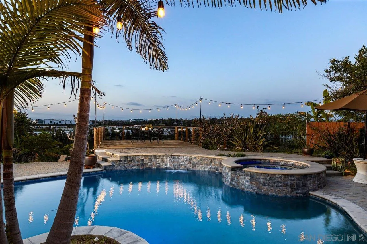 3746 Kelton Drive Oceanside, CA 92056 - Photo 6 of 49 a view of a swimming pool with a table and chairs