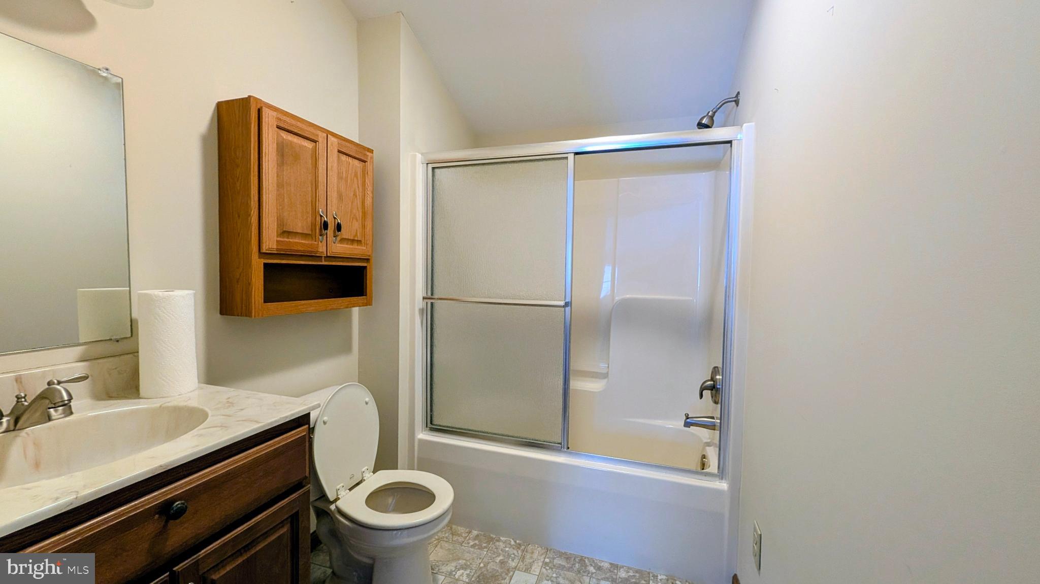 31 Rodda Road Albrightsville, PA 18210 - Photo 20 of 24 a bathroom with a granite countertop toilet sink and mirror
