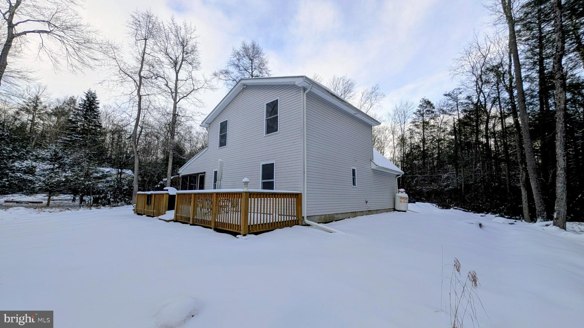 31 Rodda Road Albrightsville, PA 18210 - Photo 22 of 24 a view of a house with a yard covered in snow