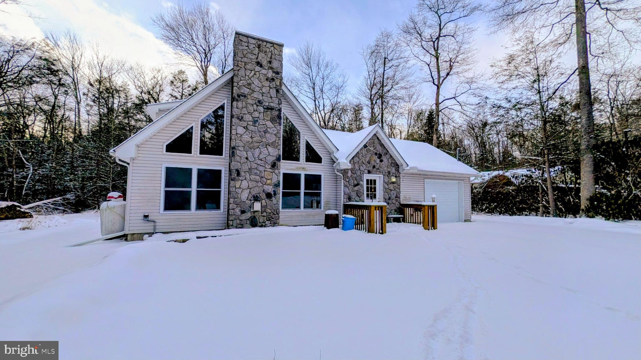 31 Rodda Road Albrightsville, PA 18210 - Photo 3 of 24 a view of a house with a yard covered in snow