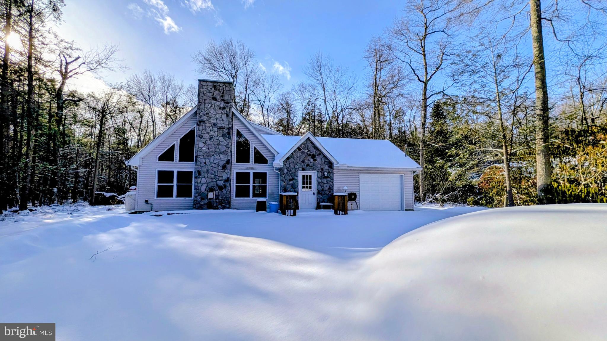 31 Rodda Road Albrightsville, PA 18210 - Photo 5 of 24 a view of a house with a yard covered in snow
