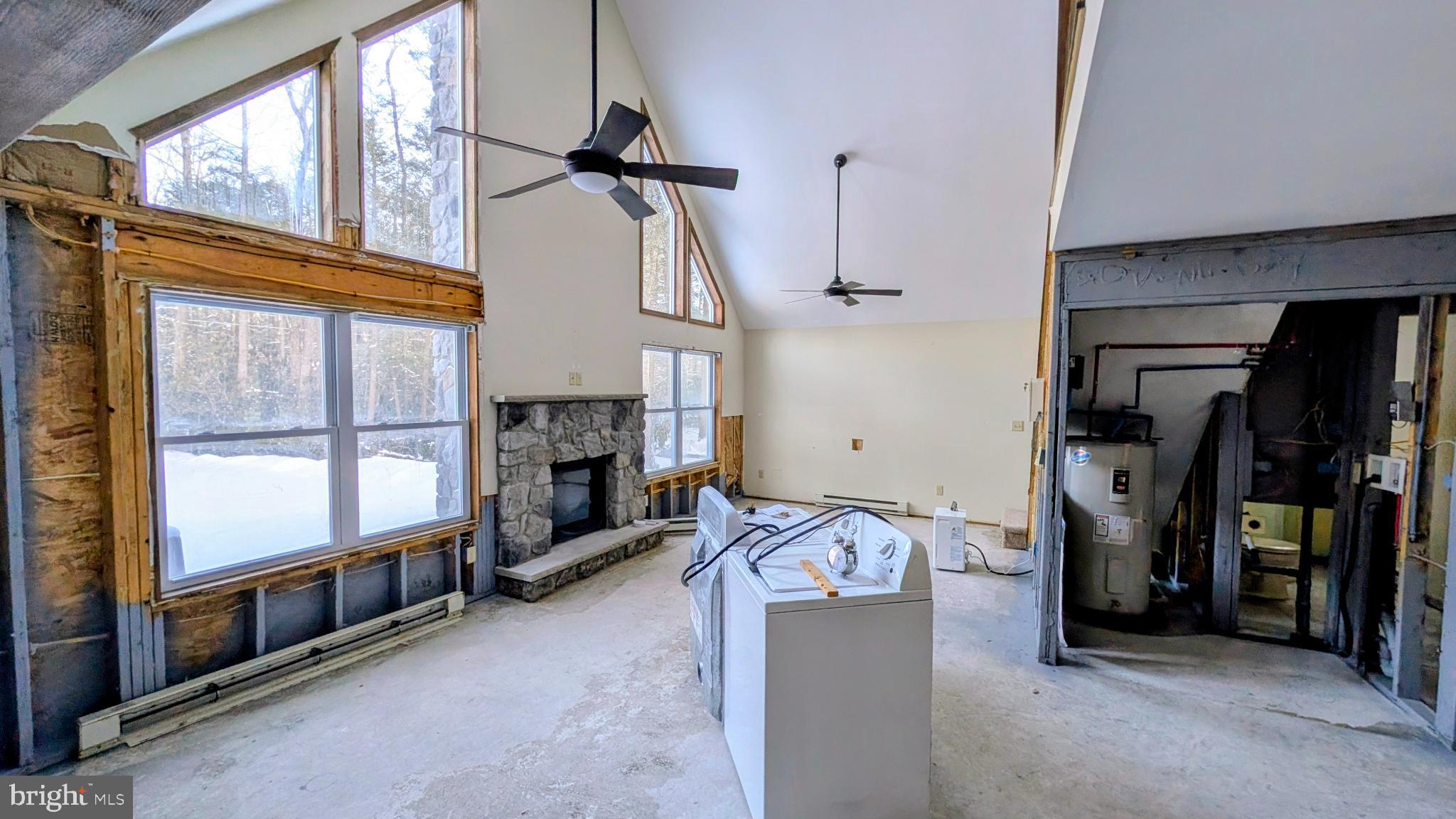 31 Rodda Road Albrightsville, PA 18210 - Photo 7 of 24 a view of a livingroom with fireplace and windows