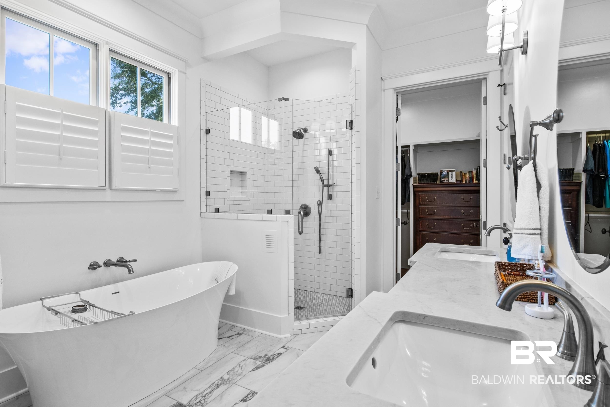 6314 Battles Road Fairhope, AL 36532 - Photo 14 of 27 Bathroom featuring double vanity, plus walk in shower, and tile patterned flooring