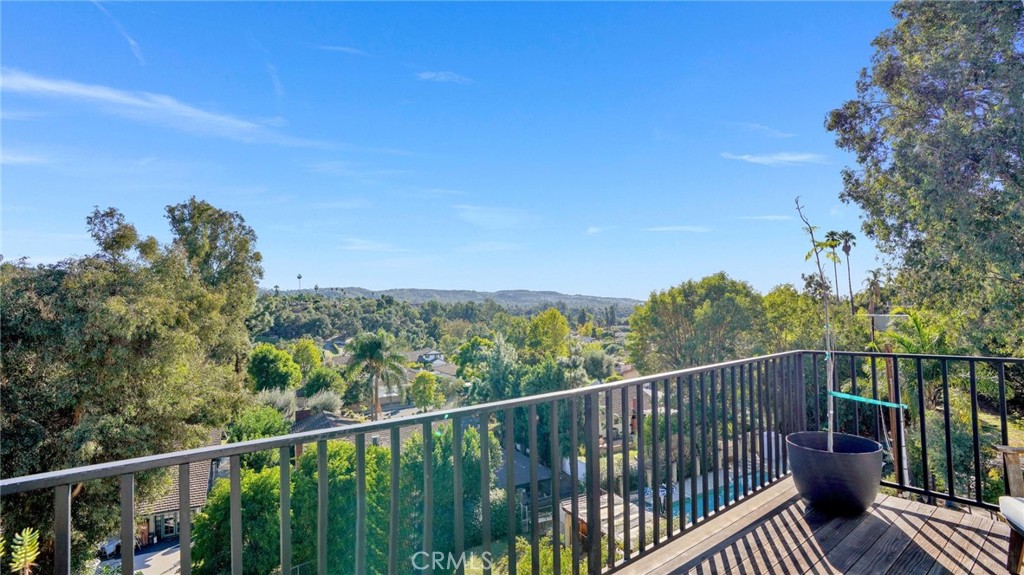 1574 East Dexter Street Covina, CA 91724 - Photo 11 of 56 a view of a balcony with wooden fence and floor
