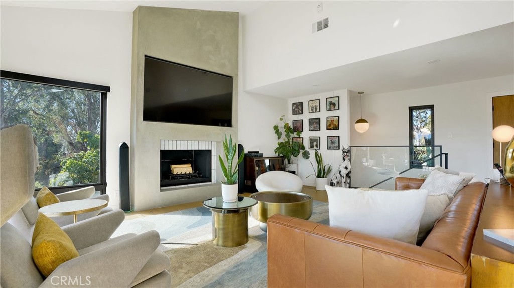 1574 East Dexter Street Covina, CA 91724 - Photo 14 of 56 a living room with furniture fireplace and a flat screen tv