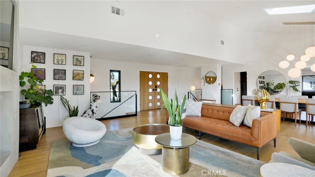 1574 East Dexter Street Covina, CA 91724 - Photo 15 of 56 a living room with furniture and a table