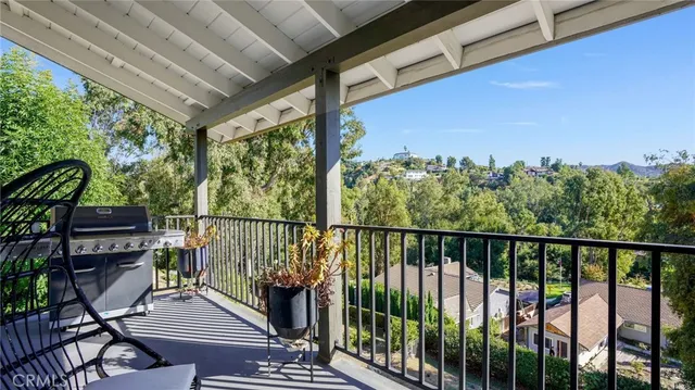 a view of a balcony with chairs