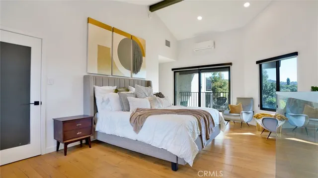 a bathroom with a granite countertop sink a mirror and shower