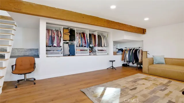 a living room with furniture and a rug
