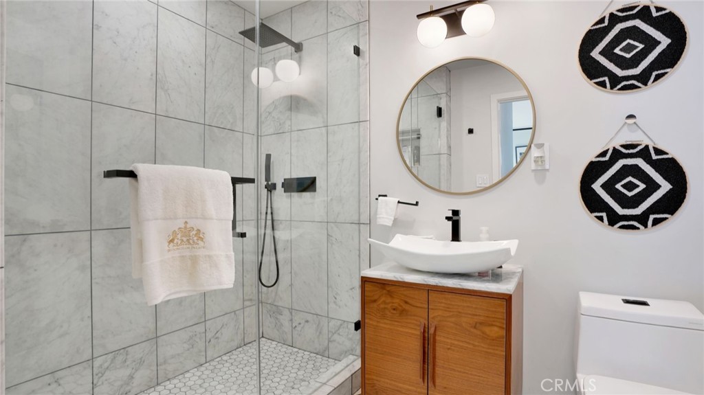 1574 East Dexter Street Covina, CA 91724 - Photo 29 of 56 a bathroom with a sink a toilet and a shower