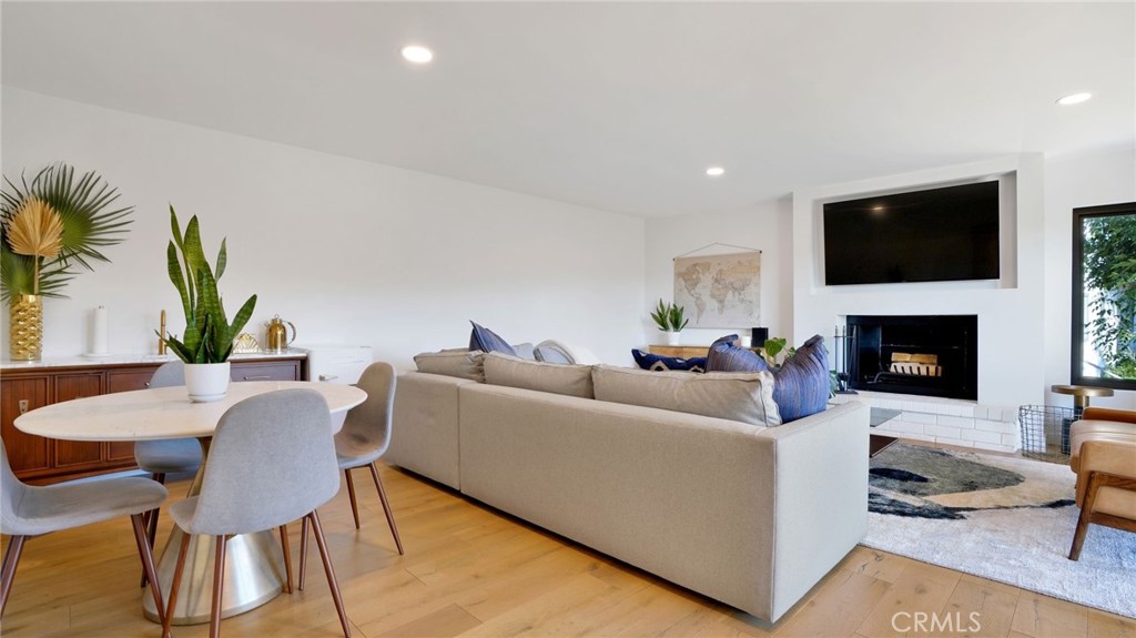 1574 East Dexter Street Covina, CA 91724 - Photo 30 of 56 a living room with furniture a flat screen tv and a fireplace
