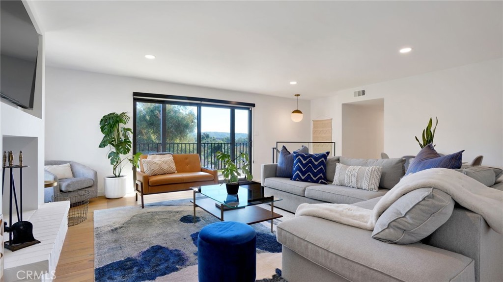 1574 East Dexter Street Covina, CA 91724 - Photo 32 of 56 a living room with furniture and a flat screen tv