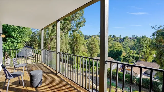 a view of a balcony with chair