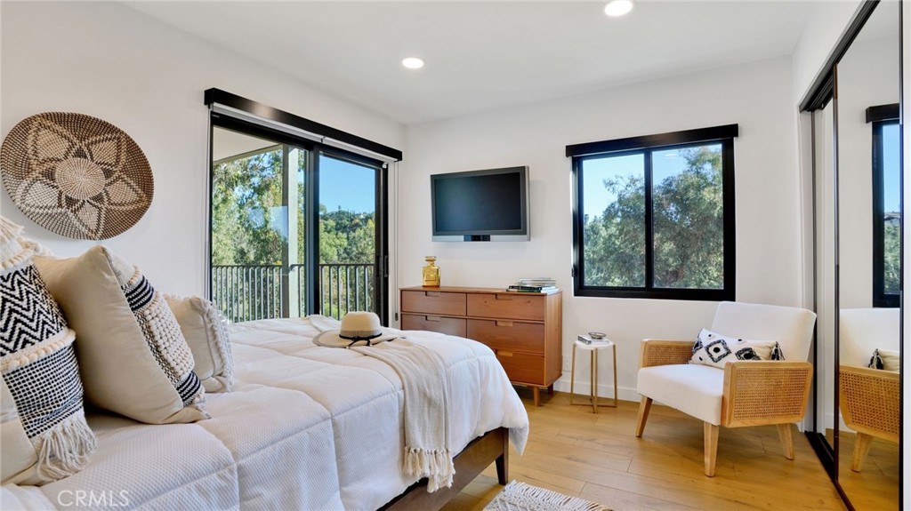 1574 East Dexter Street Covina, CA 91724 - Photo 35 of 56 a bedroom with a bed a chair and a large window