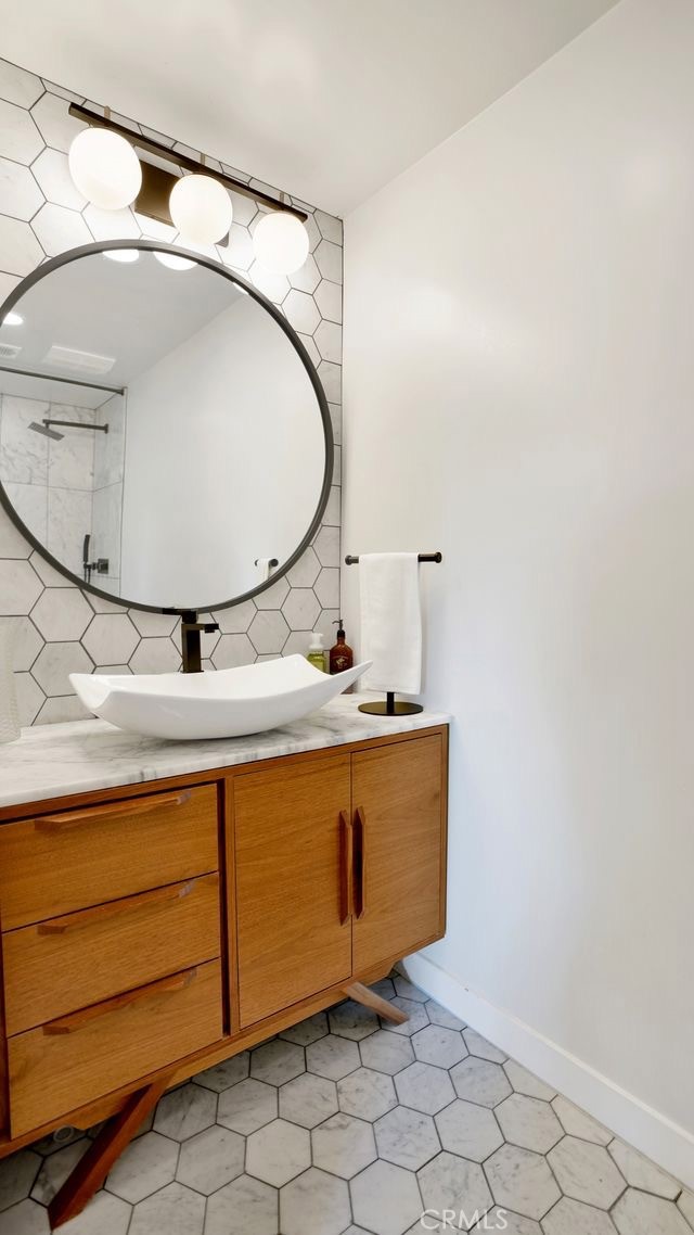 1574 East Dexter Street Covina, CA 91724 - Photo 39 of 56 a bathroom with a sink and mirror