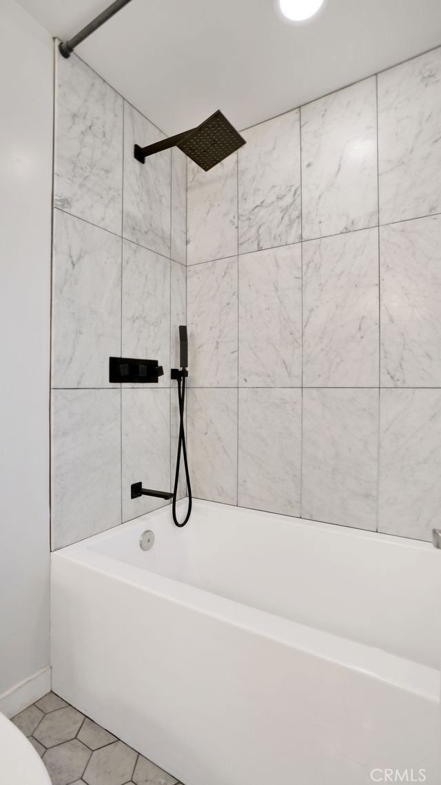 1574 East Dexter Street Covina, CA 91724 - Photo 40 of 56 a bathroom with a bathtub and shower