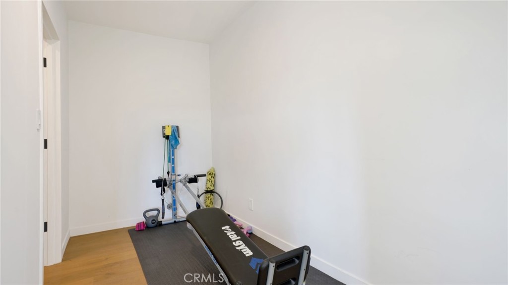 1574 East Dexter Street Covina, CA 91724 - Photo 43 of 56 a room with a rug and a potted plant