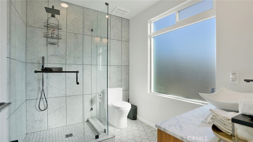 1574 East Dexter Street Covina, CA 91724 - Photo 44 of 56 a bathroom with a shower and a toilet