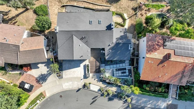 a front view of a house with a yard and balcony