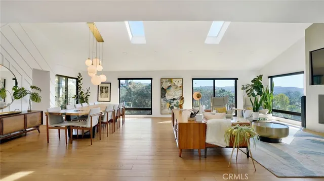 a living room with fireplace furniture and a flat screen tv