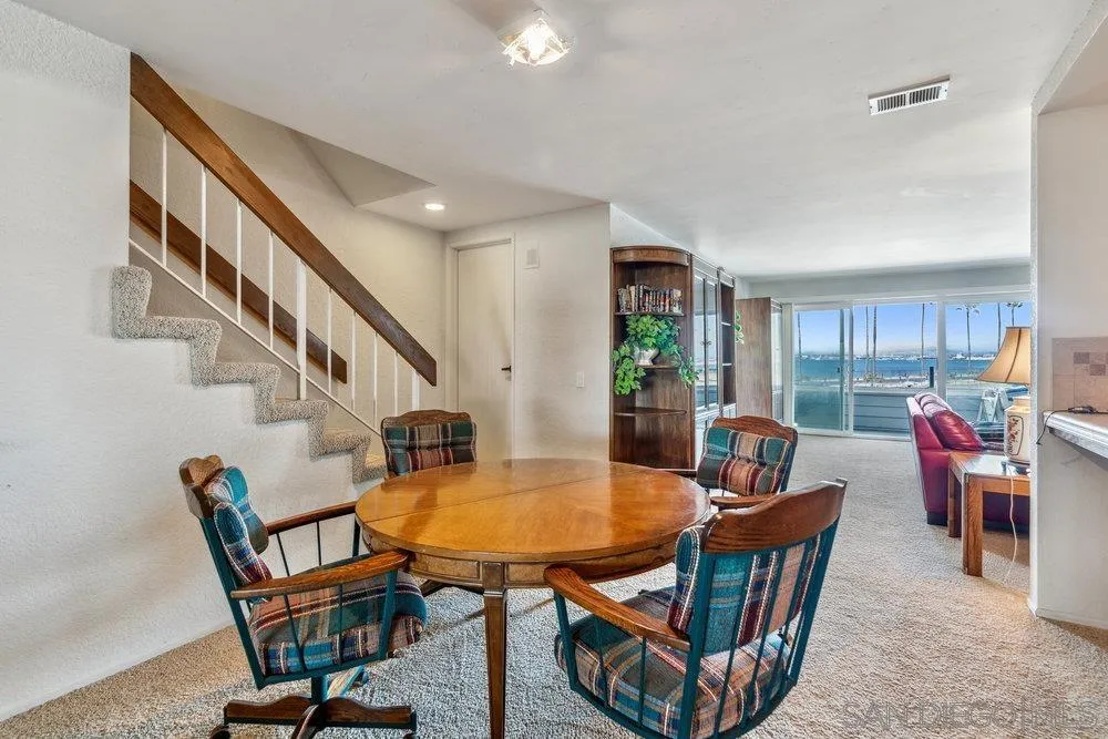 34 Montego Court Coronado, CA 92118 - Photo 14 of 31 a dining room with furniture and wooden floor