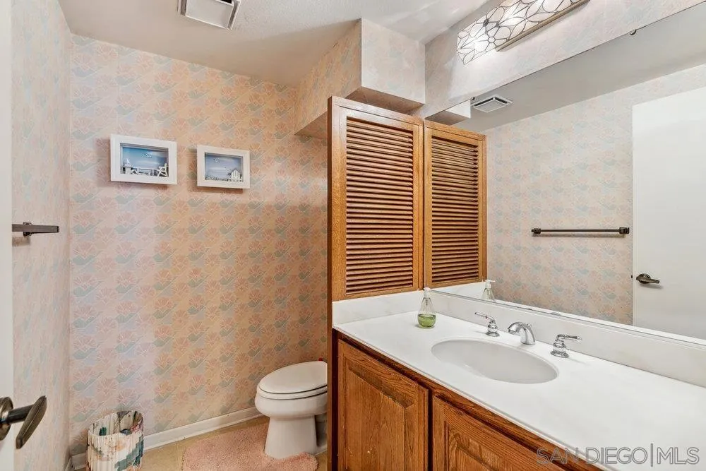 34 Montego Court Coronado, CA 92118 - Photo 19 of 31 a bathroom with a sink toilet and shower