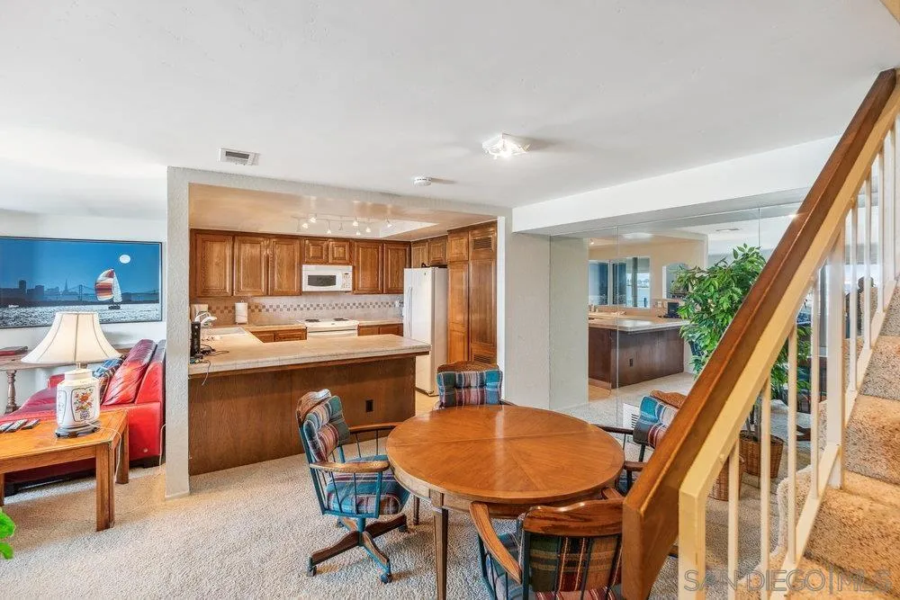 34 Montego Court Coronado, CA 92118 - Photo 20 of 31 a dining room with furniture and wooden floor