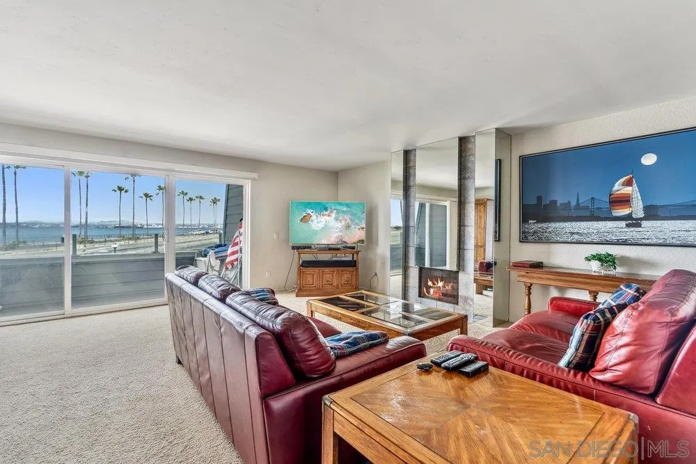 34 Montego Court Coronado, CA 92118 - Photo 10 of 31 a living room with furniture and a open kitchen view