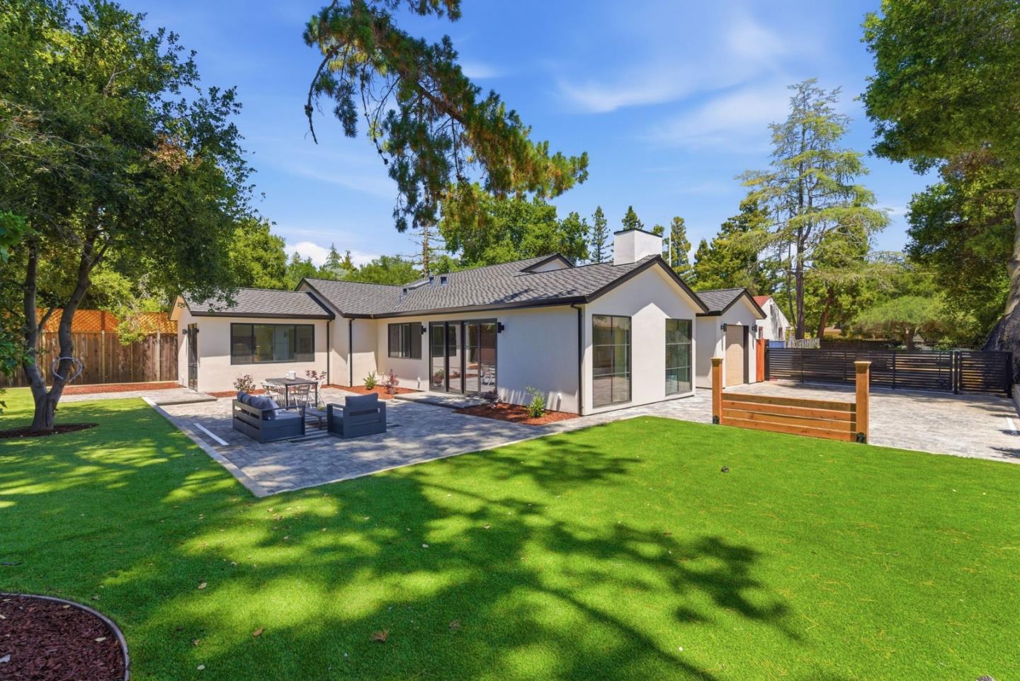 680 North San Antonio Road Los Altos, CA 94022 - Photo 1 of 19 a front view of a house with patio and garden