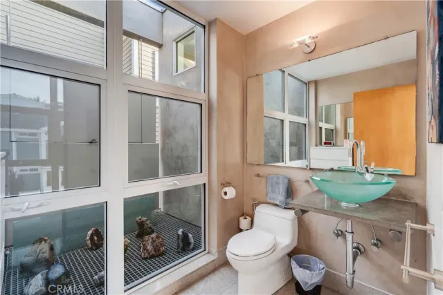 a kitchen with stainless steel appliances granite countertop a sink and a stove