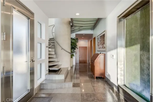 a living room with furniture a ceiling fan and a rug