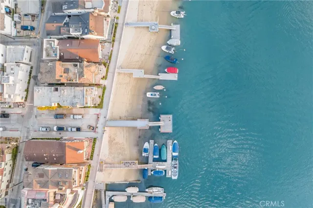 a bedroom with a bed and dresser with mirror