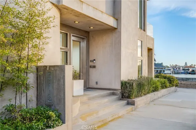 a front view of a building with sitting area