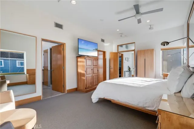 a bedroom with bed and furniture