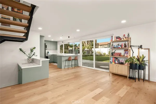 a view of kitchen with kitchen island a counter top space and a sink