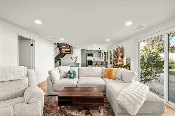 a bedroom with a bed and a ceiling fan