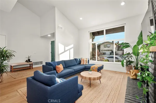 a living room with furniture and a rug