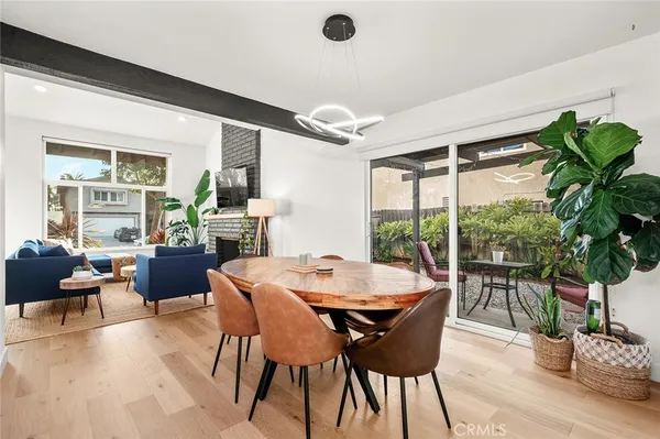 a view of kitchen with furniture and a wooden floor