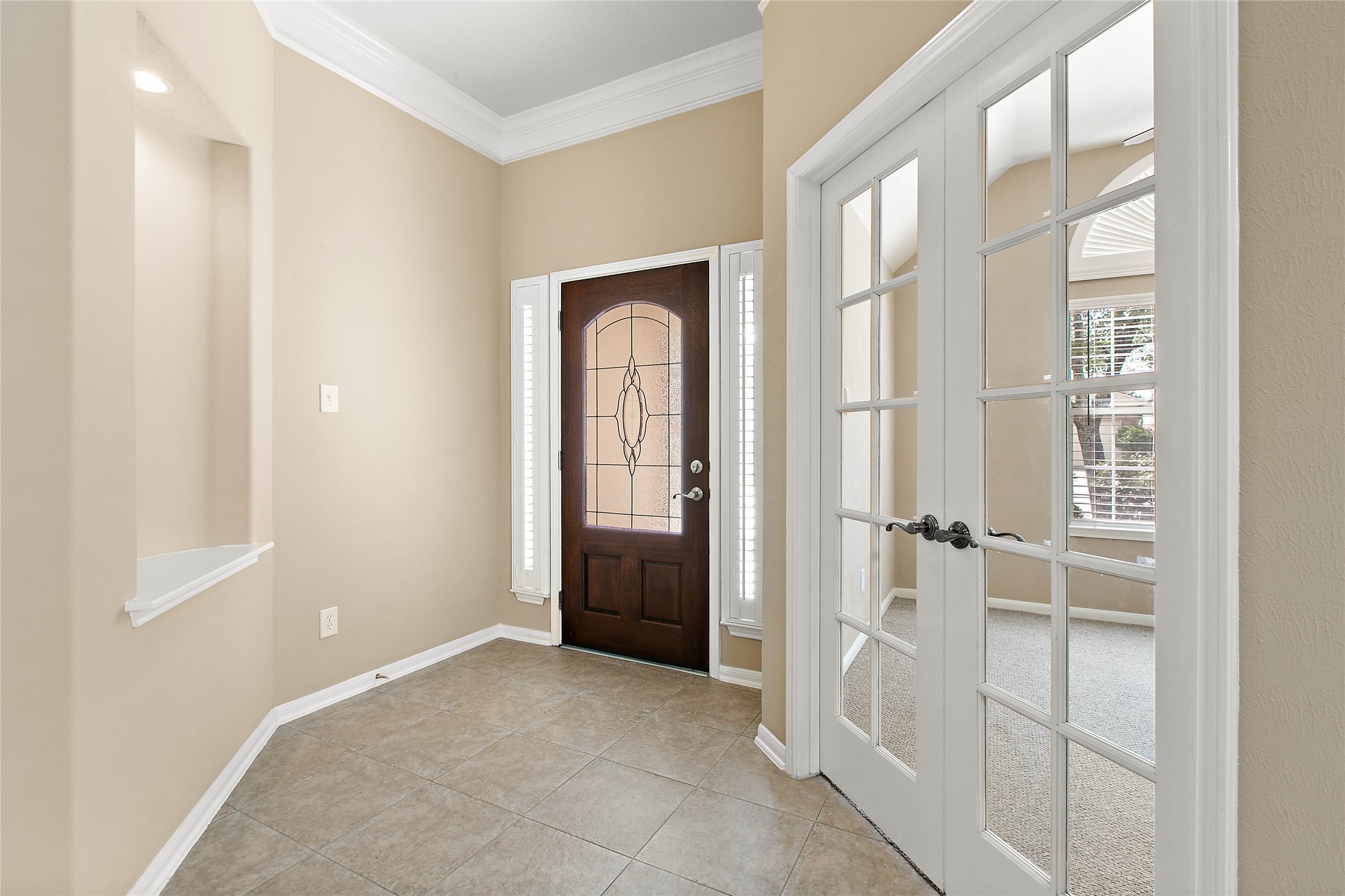 30411 Deleon Fields Drive Spring, TX 77386 - Photo 3 of 24 Step inside to an inviting foyer, showcasing beautiful finishes and an ideal home office space.