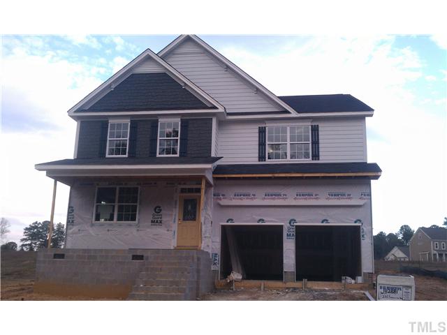 226 Strolling Way Durham, NC 27707 - Photo 1 of 12 a front view of a house with a yard