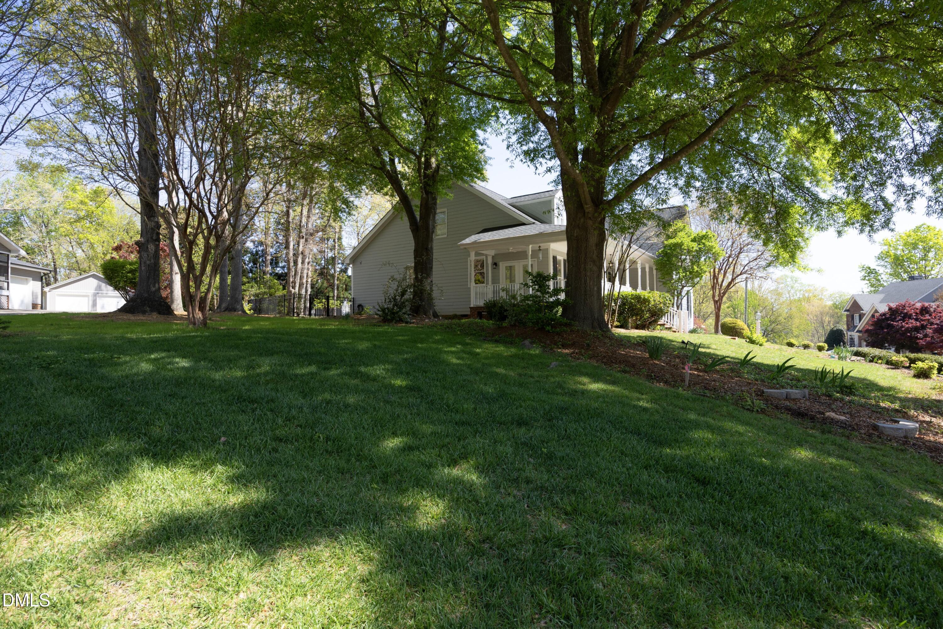 1427 Moosecreek Drive Raleigh, NC 27614 - Photo 36 of 51 a backyard of a house with table and chairs