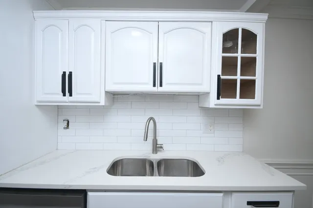 a kitchen with appliances and cabinets
