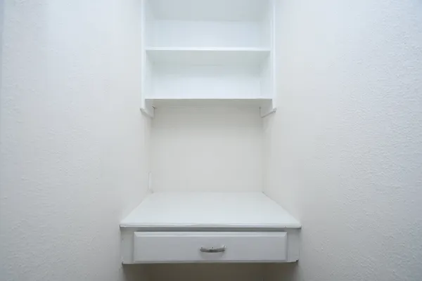 a bathroom with a bathtub shower sink mirror vanity and toilet